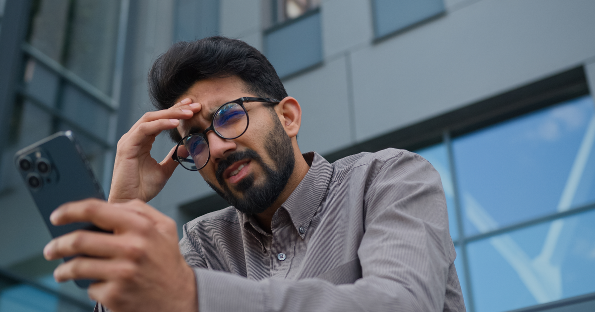 Person using a smartphone with blurry vision