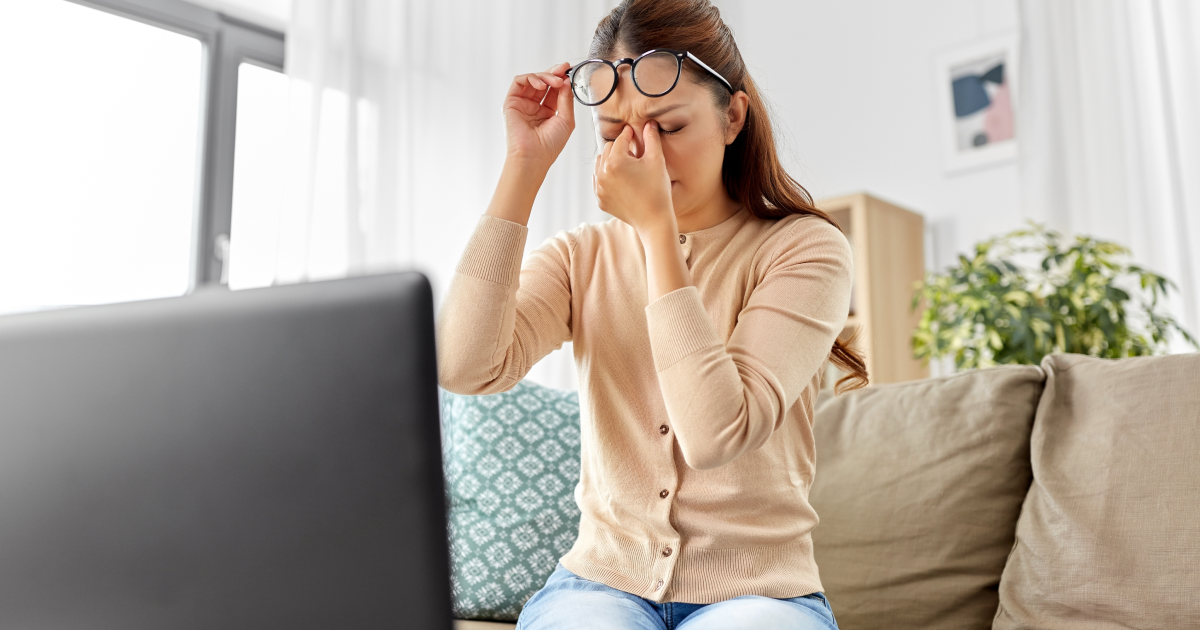 Woman rubbing her eyes