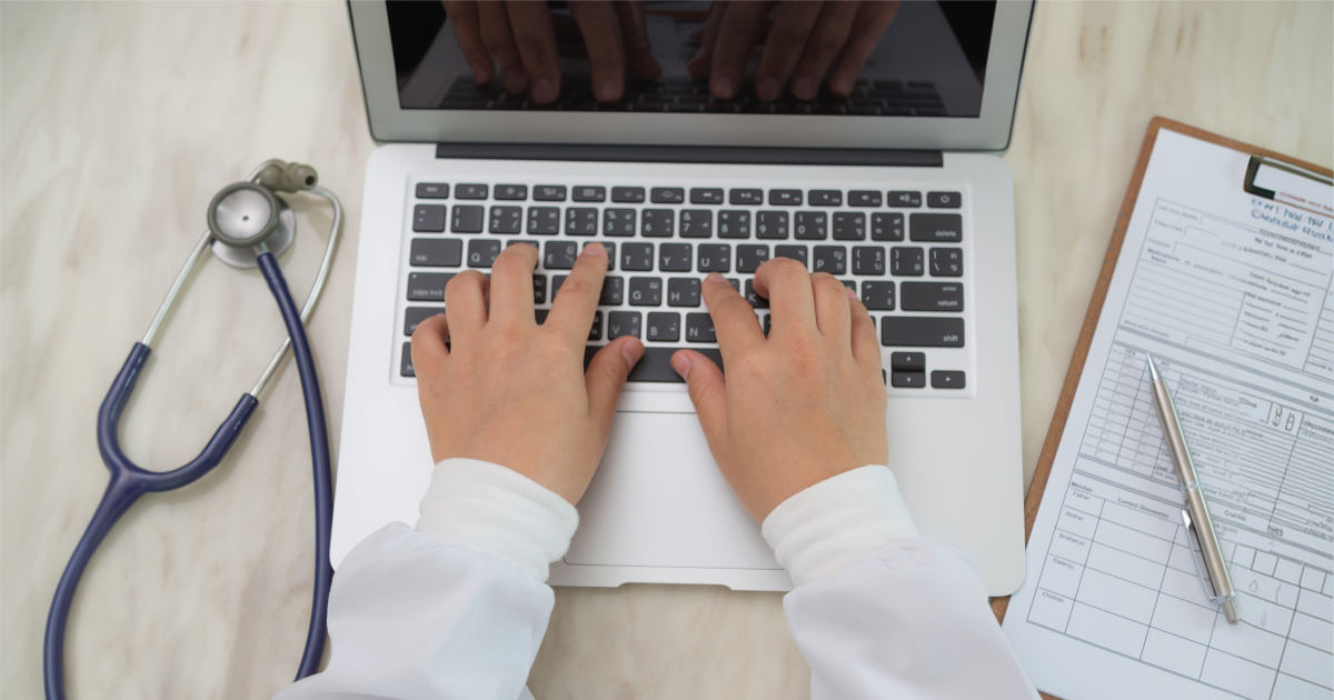 Man typing on a laptop
